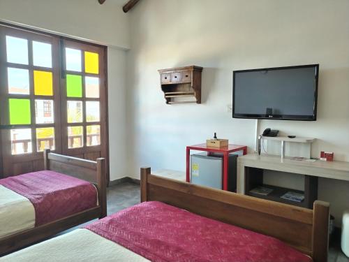 Ένα ή περισσότερα κρεβάτια σε δωμάτιο στο Hotel Capitan Ricaurte
