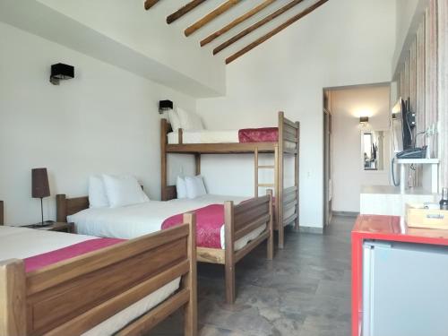 Ένα ή περισσότερα κρεβάτια σε δωμάτιο στο Hotel Capitan Ricaurte