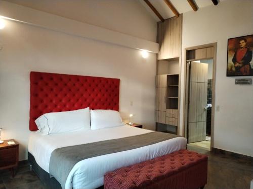Ένα ή περισσότερα κρεβάτια σε δωμάτιο στο Hotel Capitan Ricaurte