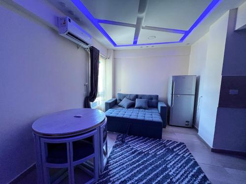 a living room with a couch and a table at Princess Resort Hurghada in Hurghada