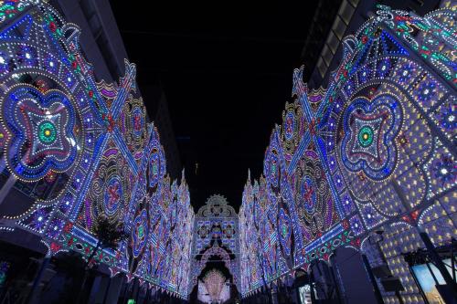 a group of lit up buildings with christmas lights at Business Ryokan Akashiya Annex in Akashi
