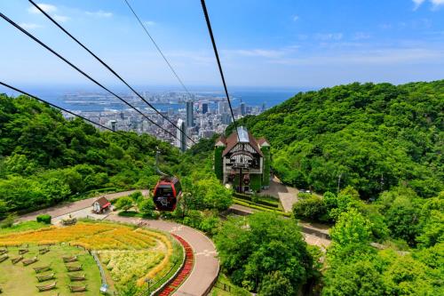 a train on a cable car ride up a mountain at Business Ryokan Akashiya Annex in Akashi