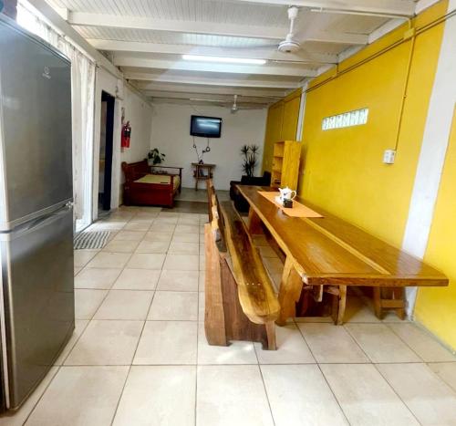 a room with a wooden table and two benches at Dona Monica in Ituzaingó