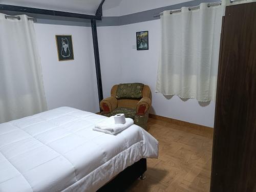Voodi või voodid majutusasutuse Hostal Ayllu toas