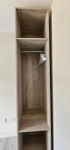 a wooden book shelf in a room at MSM Arena Hotel in London