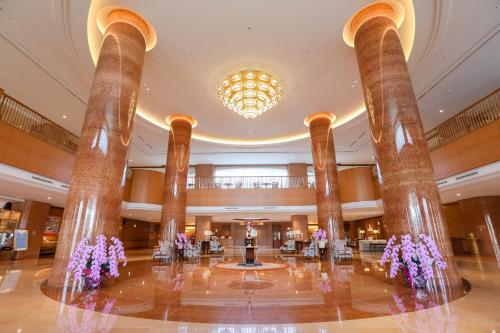 a view of the lobby of the trump international hotel casino at GrandEmpireHotel in Onojo