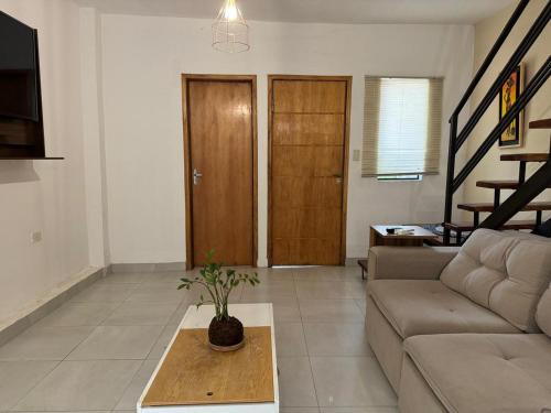 a living room with a couch and a table at Casa Privada con Piscina y Parking Gratis en Asunción in Asunción