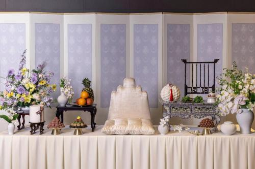 a table with vases and flowers on top of it at Four Points by Sheraton Seoul, Guro in Seoul