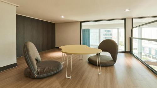 a meeting room with chairs and a table in an office at Travelodge Suites Busan Centum in Busan