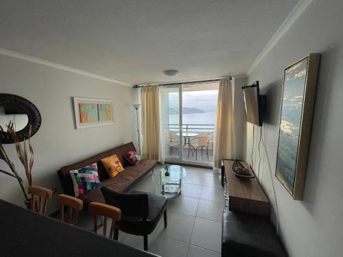 TV a/nebo společenská místnost v ubytování Apartamento Familiar junto a la playa - Vistas Increíbles