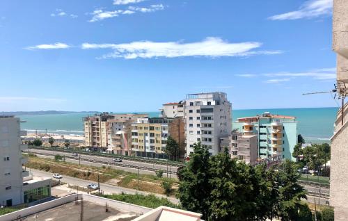 a view of a city with buildings and the ocean at Beach Apartments Durres in Durrës