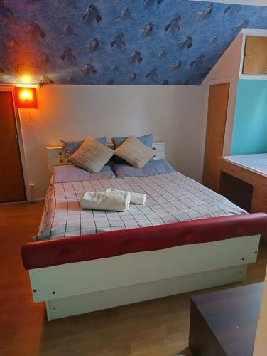 a bedroom with a bed with a fish painted on the ceiling at Joyce holiday place in Hanko