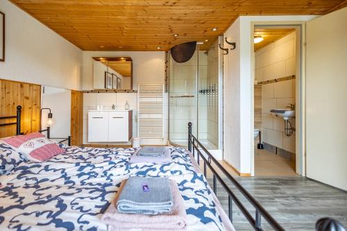 a bedroom with a large bed in a room at Landhaus Danita in Bodensdorf