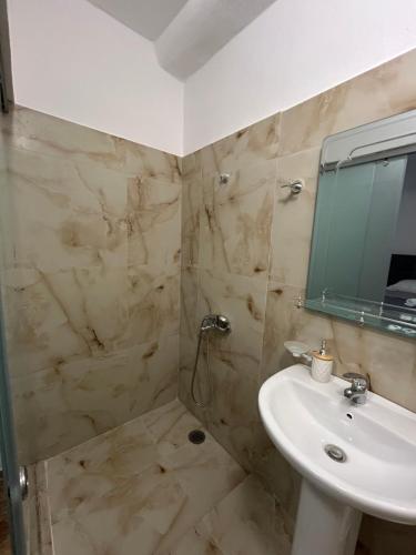 a bathroom with a sink and a mirror at Annas home in Borsh