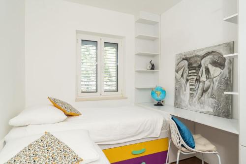 Postel nebo postele na pokoji v ubytování Seaview Elegance Apartment