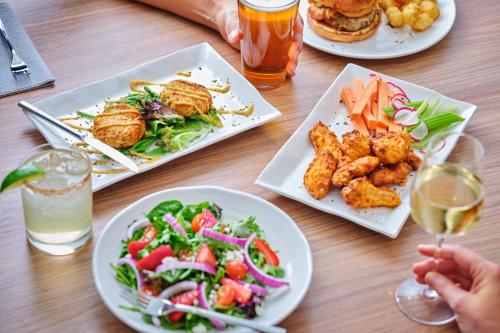 a table with three plates of food and drinks at Fairfield Inn & Suites by Marriott Tempe in Tempe