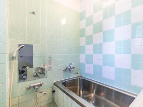 Ένα μπάνιο στο Tabist Hara Business Ryokan