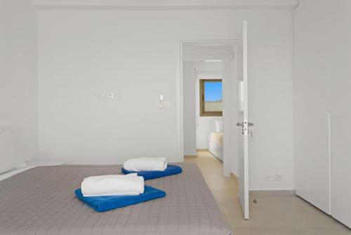 Postel nebo postele na pokoji v ubytování Serenity Waves Villa 26