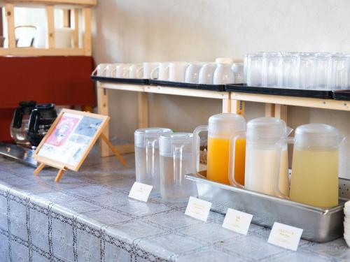 a counter with many glass jars on a table at APA Hotel Karuizawa Ekimae Karuizawaso in Karuizawa
