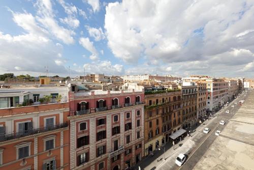 an aerial view of a city with buildings and cars at Exe International Palace in Rome