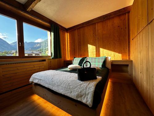 Postel nebo postele na pokoji v ubytování Enjoy Bormio