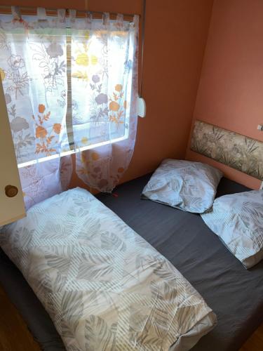 Postel nebo postele na pokoji v ubytování Le familly Team