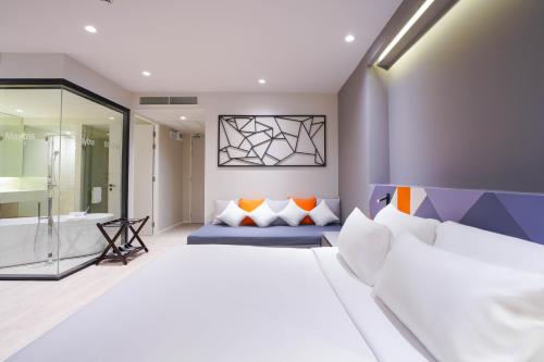 Postel nebo postele na pokoji v ubytování Maybis Hotel