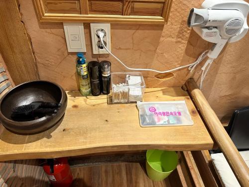 a small wooden table with a hair dryer on it at Arirang Hanok Stay in Daegu