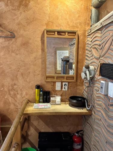 a mirror sitting on a shelf in a room at Arirang Hanok Stay in Daegu