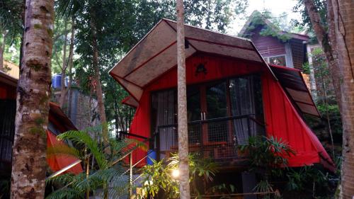 a tree house in the middle of a forest at Hau Eco Lodges Citumang Pangandaran in Pangandaran