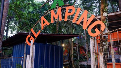 an orange sign that saysarmaofiofiofi at Hau Eco Lodges Citumang Pangandaran in Pangandaran