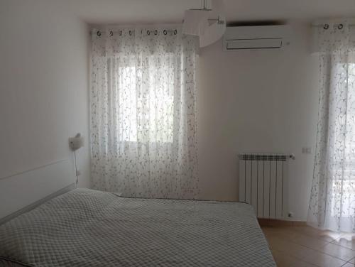 Postel nebo postele na pokoji v ubytování B&B Guesthouse La Casetta Di Sutri sulla Francigena