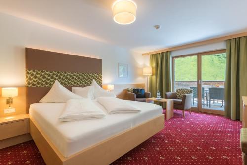Alpenresort Walsertalにあるベッド