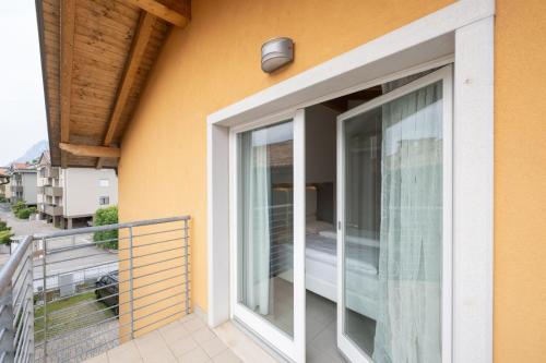 a sliding glass door on the side of a building at Residence Desiree in Riva del Garda
