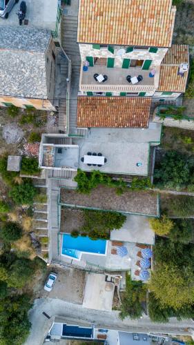 an overhead view of a house with a swimming pool at Apartments with pool Maraska in Brela
