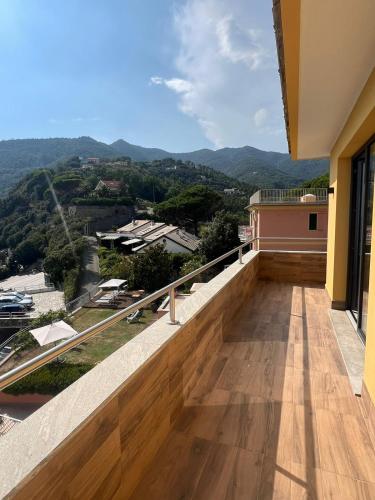 a balcony with a view of the mountains at Belvedere Mondial in Moneglia
