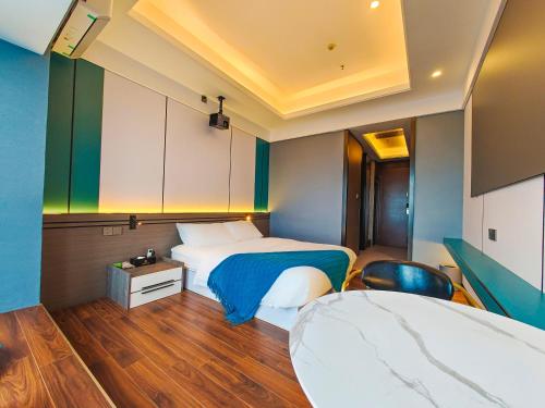 Ένα ή περισσότερα κρεβάτια σε δωμάτιο στο STAR STAGE International Apartment Hotel - 1min to Line2 & Line8 ChangGang STN-Free private car delivery to Canton Fair from Otc 15th to Nov 4th