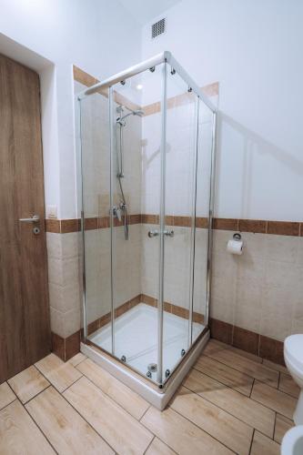 a shower with a glass enclosure in a bathroom at Sleep & Fly Malpensa in Case Nuove