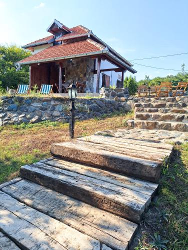 a group of steps leading up to a house at Planinska kuća Radulović in Goč