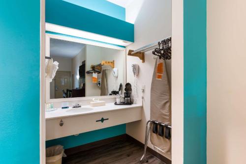 a bathroom with a sink and a mirror at Quality Inn & Suites Rockingham in Rockingham