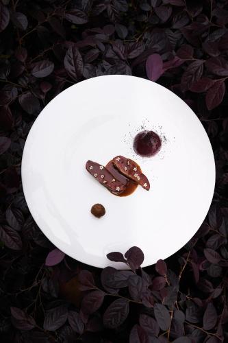 a white plate with a chocolate dessert on it at Four Seasons Hotel Firenze in Florence