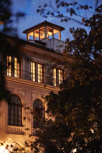 a building with a tower on top of it at Four Seasons Hotel Firenze in Florence