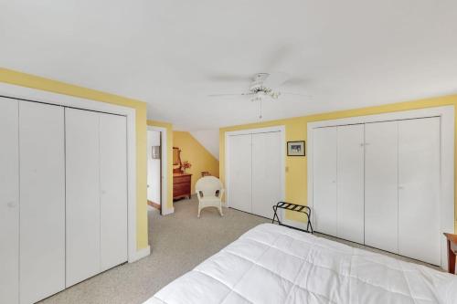 a bedroom with three white closets and a bed at Bear Pass - Mountain View home in Sunderland