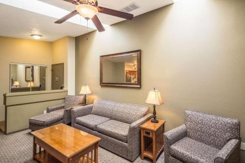 a living room with a couch and chairs and a table at Quality Inn & Suites Coeur d'Alene in Coeur d'Alene