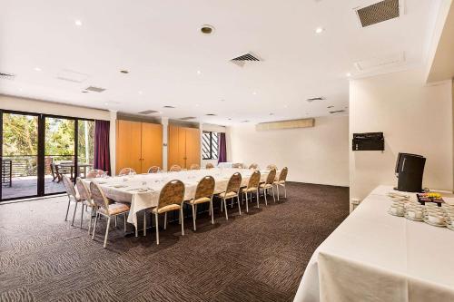 a conference room with a long table and chairs at Quality Hotel Manor in Mitcham
