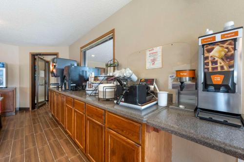 a kitchen with a counter with a cash register at Comfort Inn Lexington in Lexington