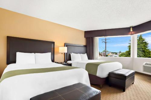a hotel room with two beds and a window at Quality Inn Port Angeles - near Olympic National Park in Port Angeles