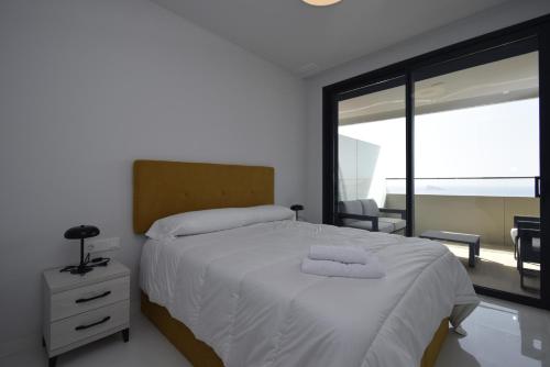 Postel nebo postele na pokoji v ubytování BENIDORM BEACH 2 dormitorios - Fincas Arena