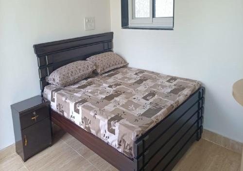 Ένα ή περισσότερα κρεβάτια σε δωμάτιο στο Vasista Farm House