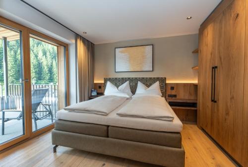 Postelja oz. postelje v sobi nastanitve PRIVATE HOMES Alpin Spa Apartments